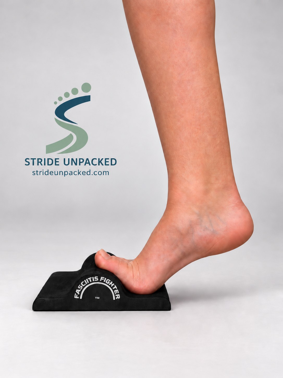 Side view of a heel raise with the toes resting on a Fasciitis Fighter, with Stride Unpacked branding.